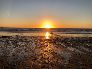 Camping above sunset beach